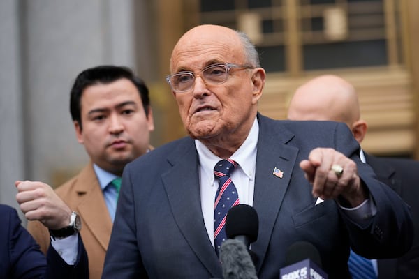 Rudy Giuliani speaks to reporters as he leaves the federal courthouse in New York, Tuesday, Nov. 26, 2024. (AP Photo/Seth Wenig)