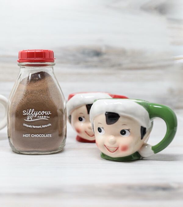 Festive ceramic elf mugs commemorate Christmas in red or green and a bottle of hot chocolate mix makes the season even sweeter. 
Courtesy of Lucy's Market