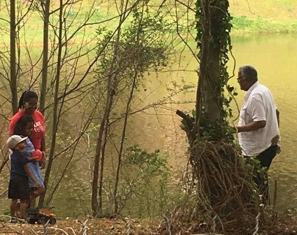 Emily Semien's husband, Leonard, enjoys a socially-distant visit with his daughter and grandchildren.