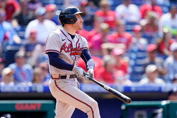 Atlanta Braves' Freddie Freeman follows through after hitting a home run off Philadelphia Phillies pitcher Hector Neris during the ninth inning of a baseball game, Thursday, June 10, 2021, in Philadelphia. (AP Photo/Matt Slocum)