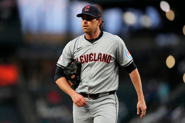 FILE - Cleveland Guardians starting pitcher Shane Bieber walks back to the dugout after throwing against the Seattle Mariners in a baseball game Tuesday, April 2, 2024, in Seattle. (AP Photo/Lindsey Wasson, File)