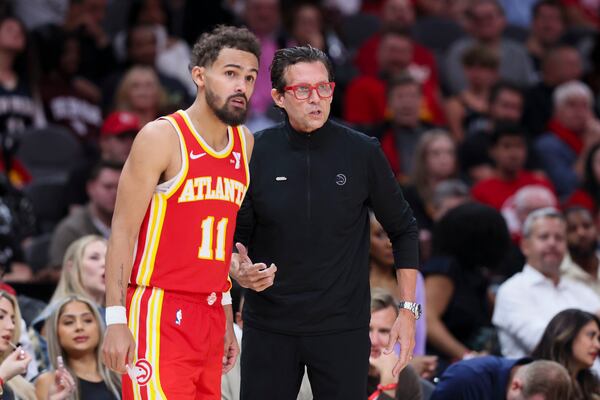 In this file photo, the Atlanta Hawks' Trae Young (11) talks with head coach Quin Snyder during the second half of a 120-116 win against the Brooklyn Nets at State Farm Arena on Oct. 23, 2024, in Atlanta. (Jason Getz/The Atlanta Journal-Constitution/TNS)