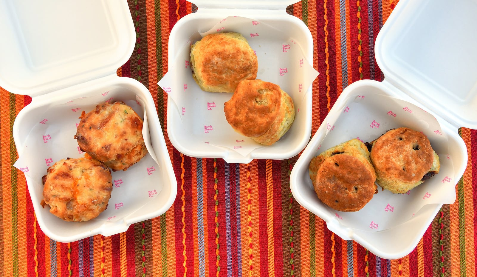 Among the varieties available at Bomb Biscuits are (from left) the black pepper bacon cheese biscuit, the Plain Jane biscuit and the chocolate chip buttermilk biscuit. Chris Hunt for The Atlanta Journal-Constitution 