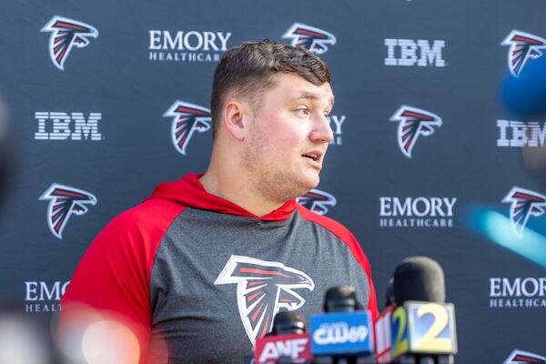 Guard Chris Lindstrom (63) speaks to press at Atlanta Falcons training camp in Flowery Branch on Tuesday, July 25, 2023. (Arvin Temkar / arvin.temkar@ajc.com)