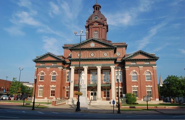 A statue of a generic Confederate soldier has stood in front of the Coweta County Courthouse in Newnan since 1885. It was erected by the Ladies' Memorial Association.