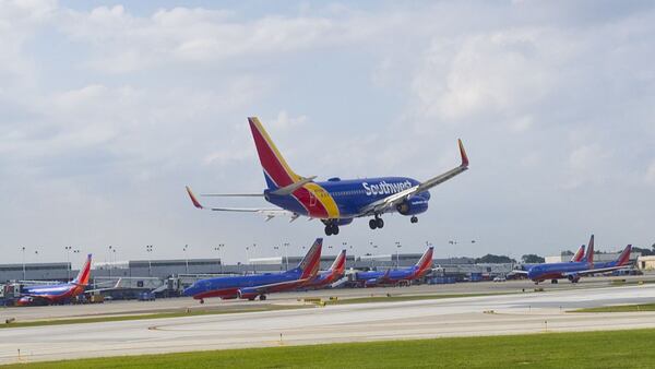 A Southwest airlines plane lands at Chicago's Midway Airport in Chicago on Sepetmber 24, 2015. AFP PHOTO / KAREN BLEIER        (Photo credit should read KAREN BLEIER/AFP/Getty Images)