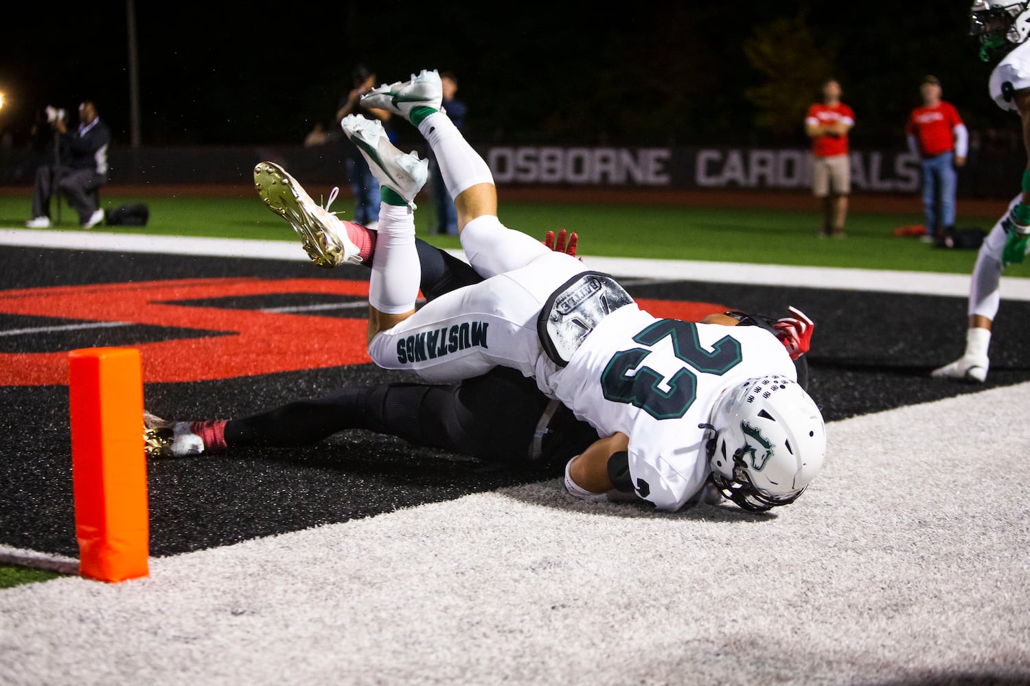 Michael Bell, strong safety for Kennesaw Mountain, makes an interception against Osborne on Friday, October 7, 2022 in Marietta. Kennesaw Mountain defeated Osborne 49-0. CHRISTINA MATACOTTA FOR THE ATLANTA JOURNAL-CONSTITUTION.