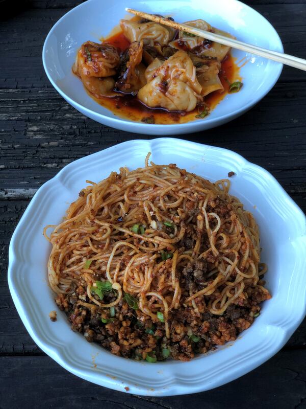 Among the dishes available for takeout from Fire Stone are dan dan noodles and wontons in chili oil. CONTRIBUTED BY WENDELL BROCK