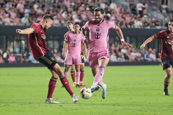 Atlanta United defender Stian Gregersen (5) and Inter Miami forward Leonardo Campana (8) go after the ball during the second half of their MLS playoff opening round soccer match, Saturday, Nov. 9, 2024, in Fort Lauderdale, Fla. (AP Photo/Lynne Sladky)