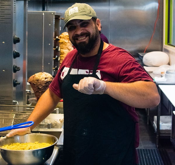 Hesham Alahmad at the falafel station. CONTRIBUTED BY HENRI HOLLIS