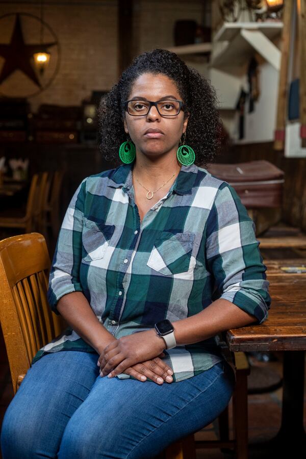 Rebecca Royster, co-founder of Dames and Dregs Beer Festival, sits for a portrait at The Porter Beer Bar in Atlanta’s Little Five Points community, Monday, June 14, 2021. (Alyssa Pointer / Alyssa.Pointer@ajc.com)