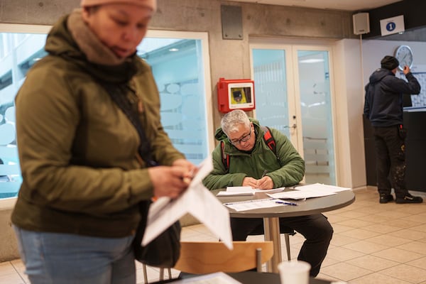 Carl Fleischer, 59, votes during early voting for Greenlandic parliamentary elections at the city hall in Nuuk, Greenland, Monday, March 10, 2025. (AP Photo/Evgeniy Maloletka)