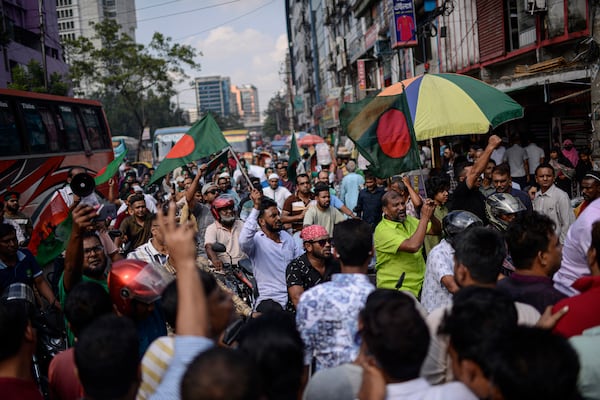 Bangladesh Nationalist Party activists shout slogans near prime minister Sheikh Hassan's Awami League party office in Dhaka, Bangladesh, Sunday, Nov. 10, 2024. (AP Photo/Mahmud Hossain Opu)