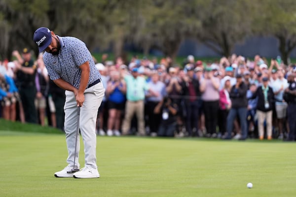 J.J. Spaun putts on the 18th green during the final round of The Players Championship golf tournament Sunday, March 16, 2025, in Ponte Vedra Beach, Fla. (AP Photo/Julia Demaree Nikhinson)