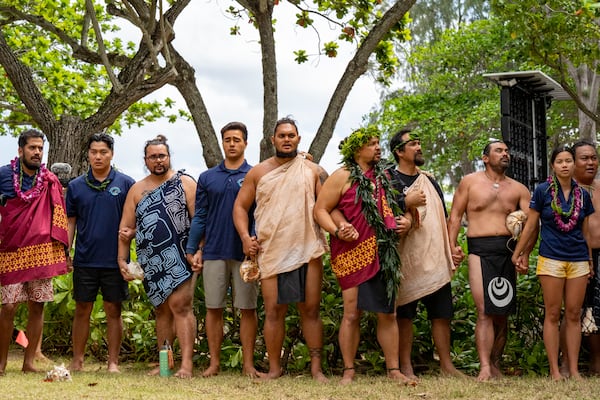 Hokulea crew members and Hawaiian culture practitioners sing during Hokulea's 50th Birthday Commemoration at Kualoa Regional Park, Saturday, March 8, 2025, in Kaneohe, Hawaii. (AP Photo/Mengshin Lin)