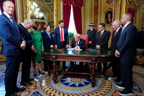 President Donald Trump, center, takes part in a signing ceremony in the President's Room after the 60th Presidential Inauguration, Monday, Jan. 20, 2025, at the U.S. Capitol in Washington. Surrounding the president are, from left, Senate Majority Leader Sen. John Thune, R-S.D.; Senate Minority Leader Chuck Schumer, D-N.Y.; Sen. Deb Fischer, R-Neb.; Sen. Amy Klobuchar, D-Minn.; Vice President JD Vance; first lady Melania Trump; House Speaker Mike Johnson, R-La.; House Majority Leader Steve Scalise, R-La.; and House Minority Leader Hakeem Jeffries, D-N.Y. (Melina Mara/The Washington Post via AP, Pool)