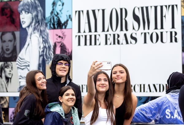 Bella Peet of Navarre, Florida takes a selfie while in line for Taylor Swift merchandise in front of Mercedes-Benz stadium in Atlanta on Thursday, April 27, 2023. (Arvin Temkar / arvin.temkar@ajc.com)