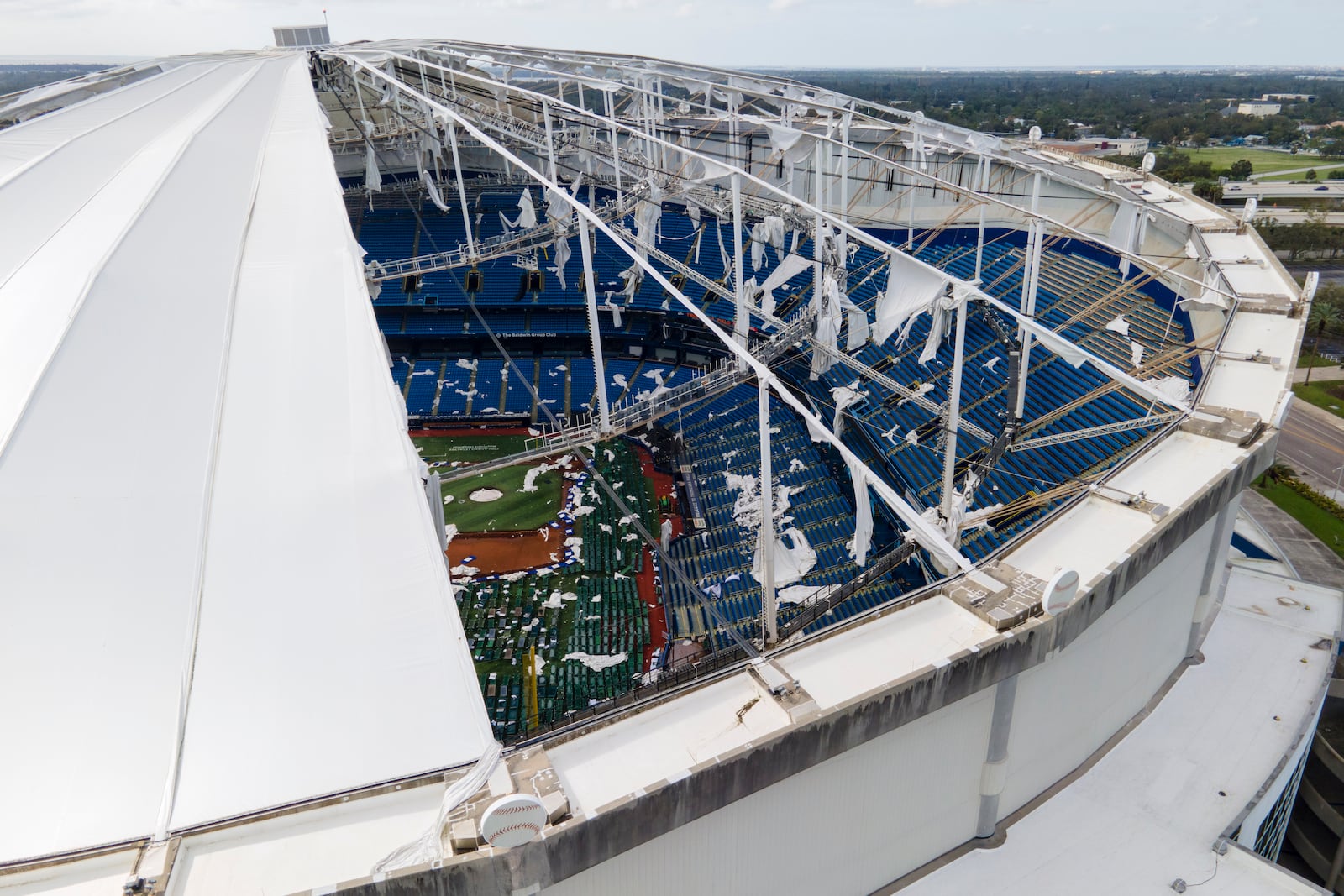 The roof of the Tropicana Field is seen damaged the morning after Hurricane Milton hit the region, Thursday, Oct. 10, 2024, in St. Petersburg, Fla. (AP Photo/Julio Cortez)