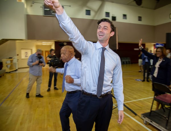 U.S. Senate candidate Jon Ossoff (foreground) and U.S. Rep. John Lewis wave to the crowd at the start of a voter registration rally at the MLK Recreation Center in Atlanta on Saturday, September 28, 2019. (Photo: STEVE SCHAEFER / SPECIAL TO THE AJC)