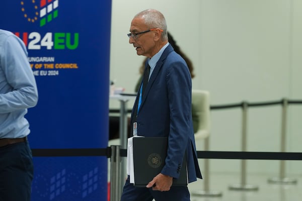 John Podesta, U.S. climate envoy, walks in the hallway during the COP29 U.N. Climate Summit, Saturday, Nov. 23, 2024, in Baku, Azerbaijan. (AP Photo/Peter Dejong)