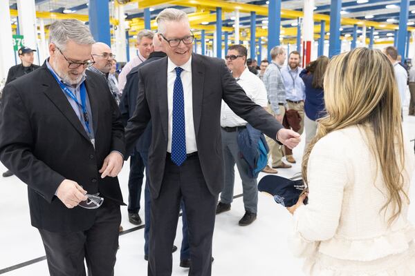 Delta CEO Ed Bastian talks with people after a Ribbon-cutting at deltas new Geared Turbofan shop Tuesday, Feb. 7, 2023  (Steve Schaefer/steve.schaefer@ajc.com)