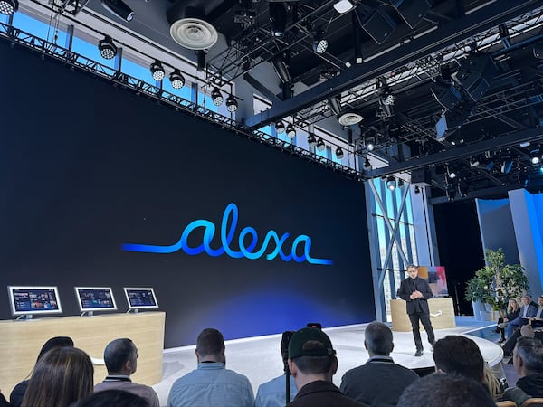 People attend an event where Amazon on Wednesday, Feb. 26, 2025 unveiled a generative-AI infused Alexa that it says will allow the popular voice assistant to have more personality, check a user’s tone and even plan romantic dates. (AP Photo/Wyatte Grantham-Philips)