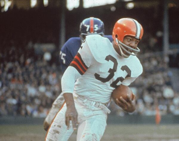 Hall of Famer Jim Brown rushes for 12,312 yards over nine NFL seasons. (Associated Press)