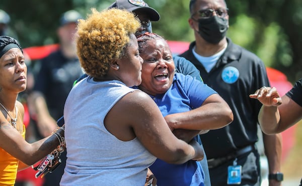 Friends and family members were visibly distraught Tuesday morning after learning a 33-year-old mother of five was shot to death at a southeast Atlanta apartment complex.


