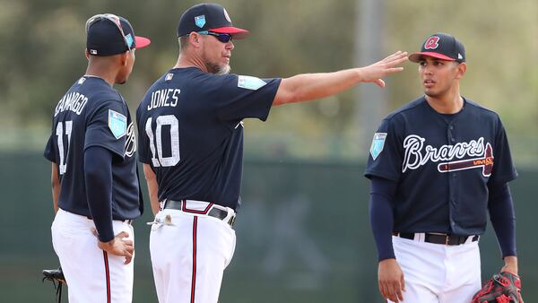 Feb 19, 2018 Lake Buena Vista: Braves recently elected Hall of Fame third baseman Chipper Jones works at third base with Johan Camargo (left) and Rio Ruiz at spring training during the first full squad workout on Monday, Feb 19, 2018, at the ESPN Wide World of Sports Complex in Lake Buena Vista. Jones was helping coach the team for the day.     Curtis Compton/ccompton@ajc.com