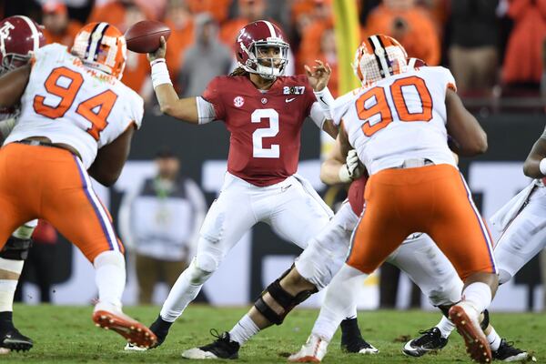 Alabama quarterback Jalen Hurts looks to pass against Clemson in the the 2017 College Football Playoff championship game.