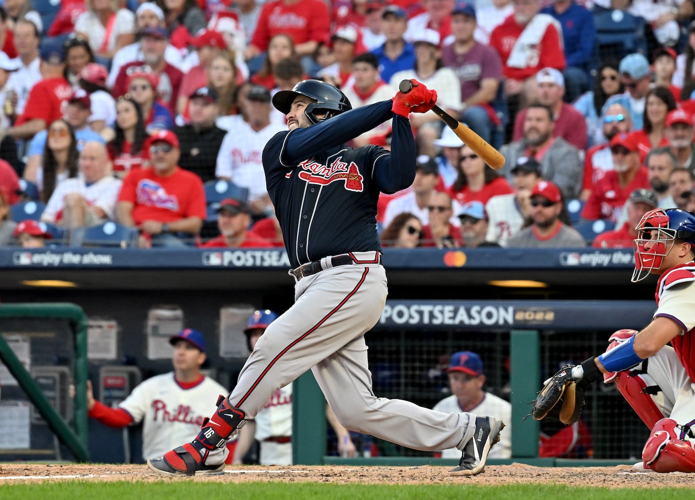 Atlanta's Travis d'Arnaud hits a solo homer against the host Phillies during the seventh inning in Game 4 of the NLDS on Saturday. (Hyosub Shin / Hyosub.Shin@ajc.com)