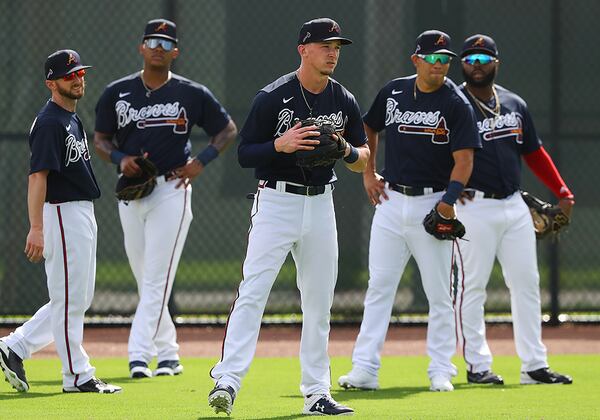 Braves outfielders Shane Robinson (from left), Cristian Pache, Drew Waters, Rafael Ortega, and Trey Harris get is some work in the outfield during spring training Wednesday, Feb. 19, 2020, at CoolToday Park in North Port, Fla.