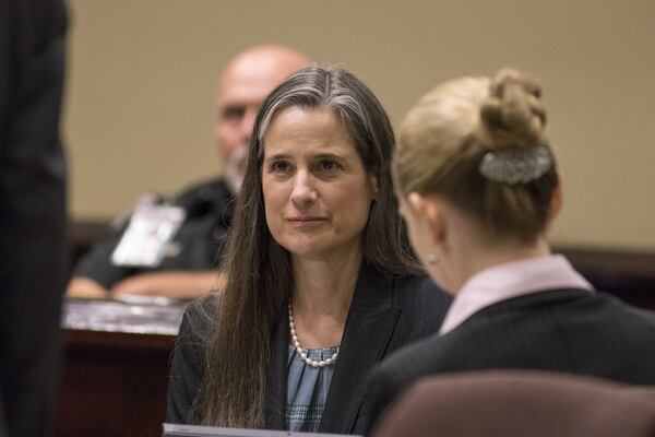 Nydia Tisdale sits with her lawyers on Thursday, Nov. 30, 2017, during her trial at the Dawson Superior Court. 