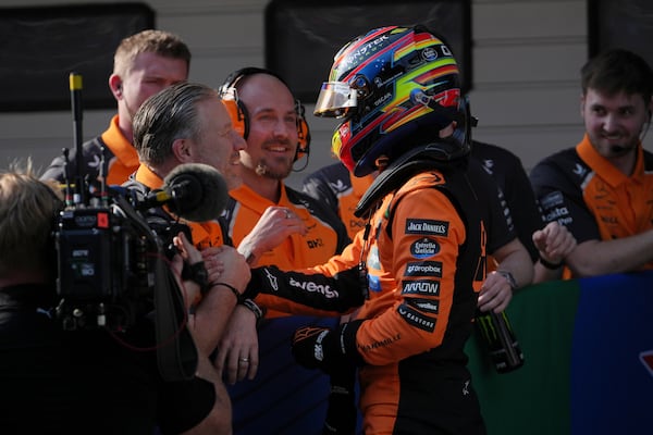 McLaren driver Oscar Piastri of Australia celebrates his pole position after qualifying session for the Chinese Formula One Grand Prix at the Shanghai International Circuit, Shanghai, Saturday, March 22, 2025. (AP Photo/Andy Wong)