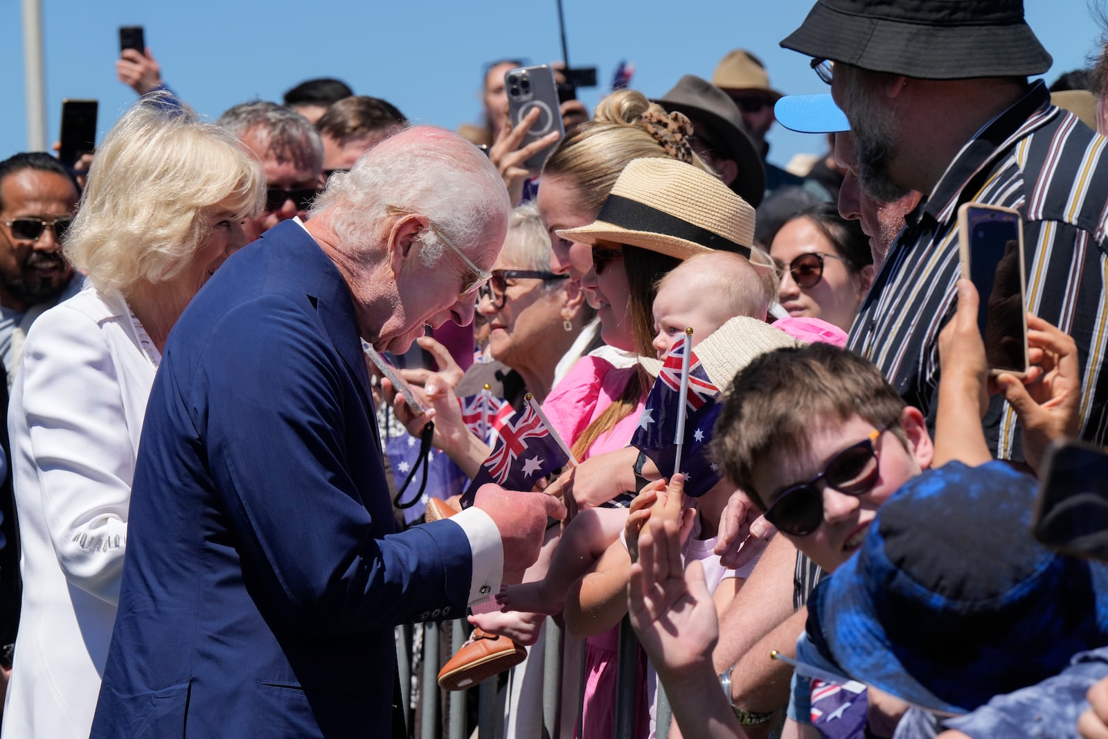 Britain's King Charles III, and Queen Camilla chats with public before they leave the Australian War Memorial in Canberra, Monday, Oct. 21, 2024. (AP Photo/Mark Baker, Pool)