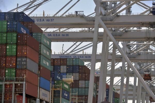 Six Georgia Ports Authority neo-panamax ship-to-shore cranes work the container ship Cosco Development at the Port of Savannah, Friday, May 12, 2017, in Garden City, Ga. At the time, the ship was the largest vessel ever to call on the U.S. East Coast. (Steve Bisson/Savannah Morning News via AP)