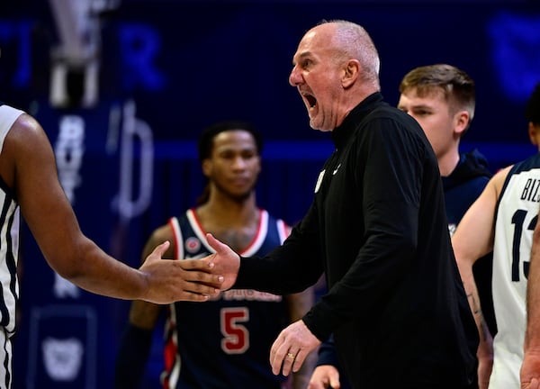 Butler head coach Thad Matta high-fives forward Pierre Brooks II during the second half of an NCAA college basketball game, Wednesday, Feb. 26, 2025, in Indianapolis, Ind. (AP Photo/Marc Lebryk)