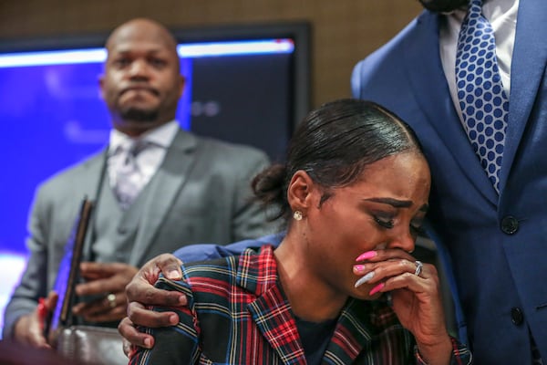 February 12, 2019 Atlanta: Attorney Chris Stewart (left) addresses the media Tuesday morning, Feb. 12, 2019 as his client, Jasmine Eiland (center) is comforted by attorney Joshua Palmer (right). It is the policy of the AJC to not name alleged victims of sexual crimes, but in this case the victim chose to publicly discuss the incident.  JOHN SPINK/JSPINK@AJC.COM