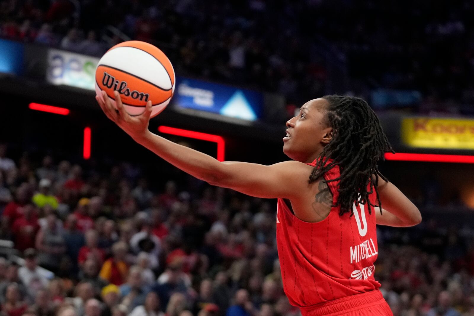 Indiana Fever's Kelsey Mitchell puts up a shot during the first half of a WNBA basketball game against the Las Vegas Aces, Wednesday, Sept. 11, 2024, in Indianapolis. (AP Photo/Darron Cummings)