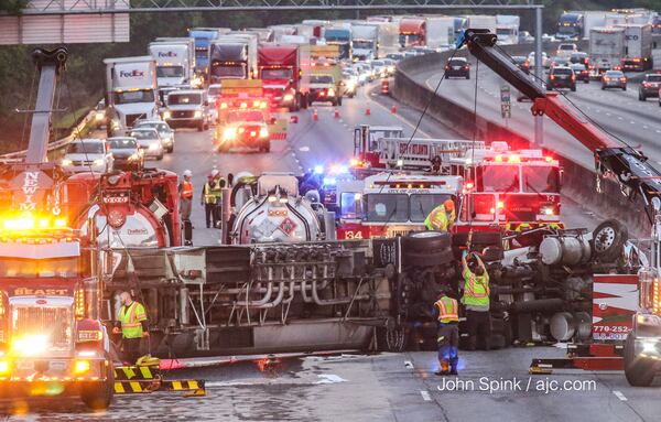 A tanker truck crash and fuel spill has I-285 shut down in both directions for hours Tuesday morning. JOHN SPINK / JSPINK@AJC.COM