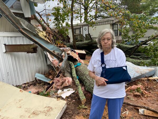 Brenda Phillips said she's lucky to be alive after an oak tree fell on her neighbor's trailer Thursday morning, killing a 22-year-old as he slept.