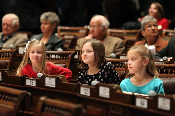 Children from left to right; Mary Claire Griner, 8, Rebecca Moody, 7, and Ellie Griner, 6, sit in the Georgia House chamber before Court of Appeals Judge Michael Boggs is sworn in in January 2012. The girls, all from Valdosta, traveled with their family to witness the ceremony because Michael Boggs is Rebecca Moody's uncle and the Griners are close friends with Boggs.  January 9, 2012. Jason Getz jgetz@ajc.com