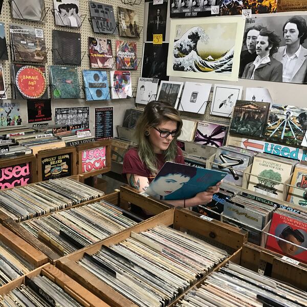 Radford interviewed Bella Reece, lost in the stacks at Wax’n’Facts (where she works part-time), for his book.