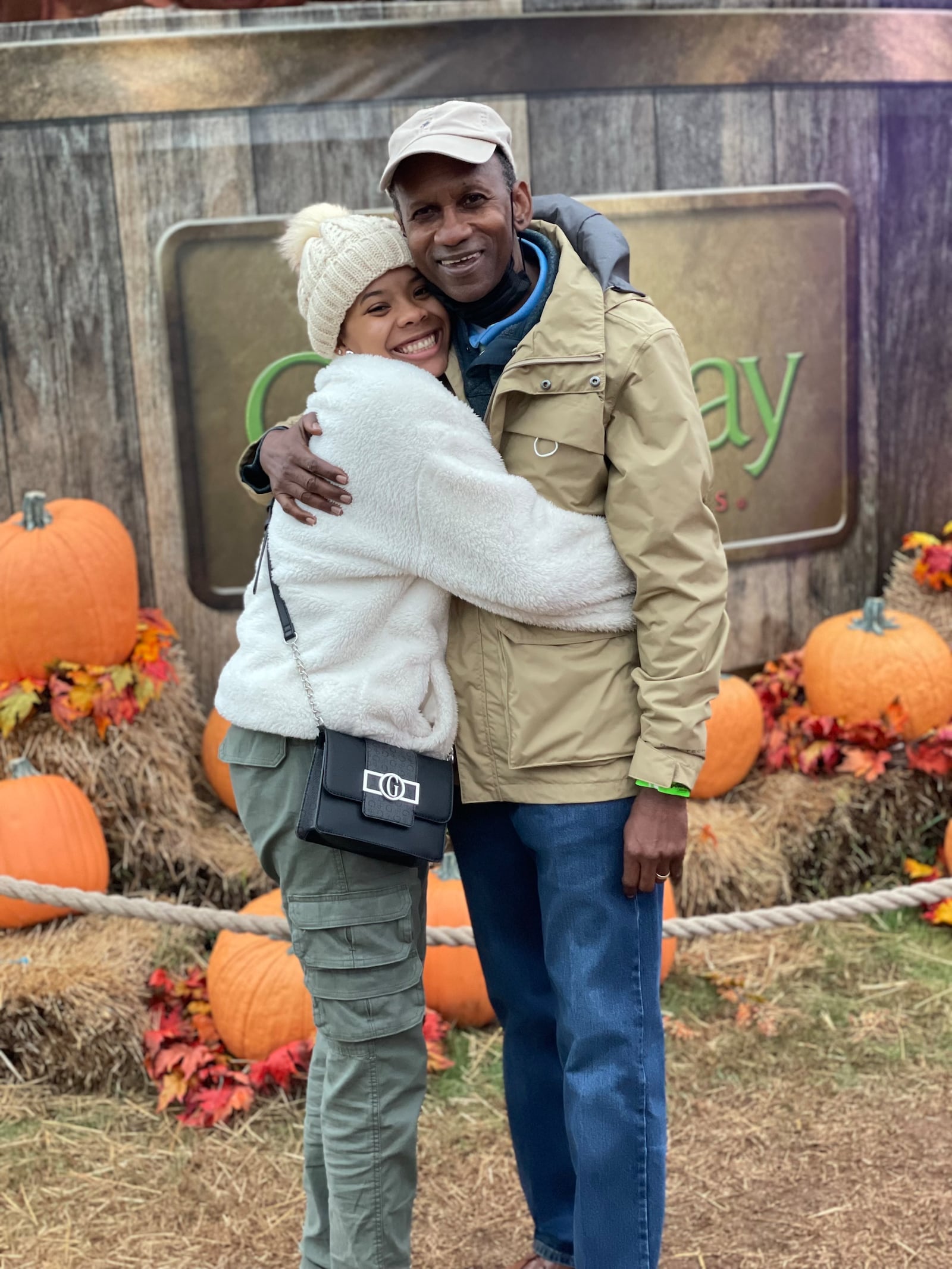 William Johnson Jr. and his daughter, Alaina, hug during a trip to Callaway Gardens.