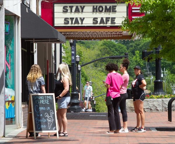 People stand in line for ice cream at Sarah Jean's Ice Cream on the Marietta Square Saturday, April 25, 2020. STEVE SCHAEFER / SPECIAL TO THE AJC