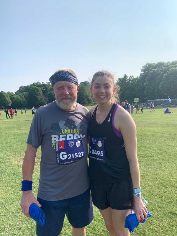 Daughter and father Olivia Vernon, 24, and Mike Vernon, 70, of McDonough have been running the race together for years. (Photo: Caroline Silva/AJC)