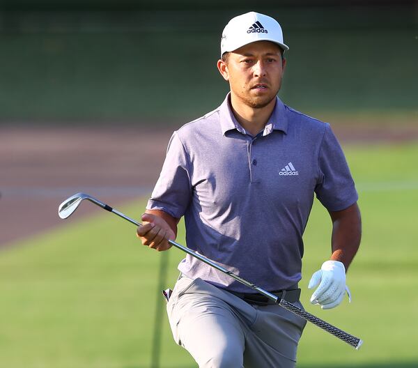 Xander Schauffele reacts to his chip to the 18th green where he made a birdie to finish with a round of 67 at 14-under par during the third round of the Tour Championship Sunday, Sept. 6, 2020, at East Lake Golf Club in Atlanta. Schauffele and Justin Thomas are tied in second place five strokes behind leader Dustin Johnson.  (Curtis Compton / Curtis.Compton@ajc.com)