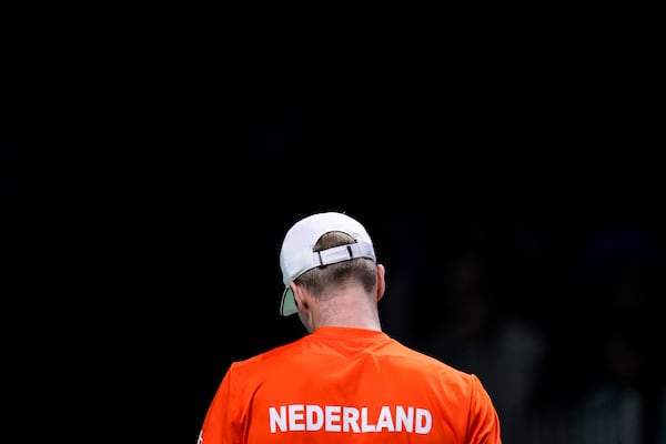 Netherlands' Botic van de Zandschulp reacts during his match against Italy's Matteo Berrettini during the Davis Cup final tennis match between Netherlands and Italy at the Martin Carpena Sports Hall in Malaga, southern Spain, on Sunday, Nov. 24, 2024. (AP Photo/Manu Fernandez)