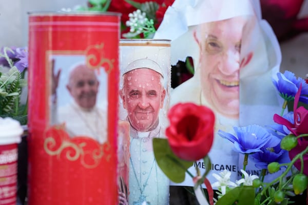 Candles and flowers for Pope Francis are seen at the Agostino Gemelli Polyclinic, in Rome, Wednesday, Feb. 26, 2025, where the Pontiff is hospitalized since Friday, Feb. 14. (AP Photo/Andrew Medichini)