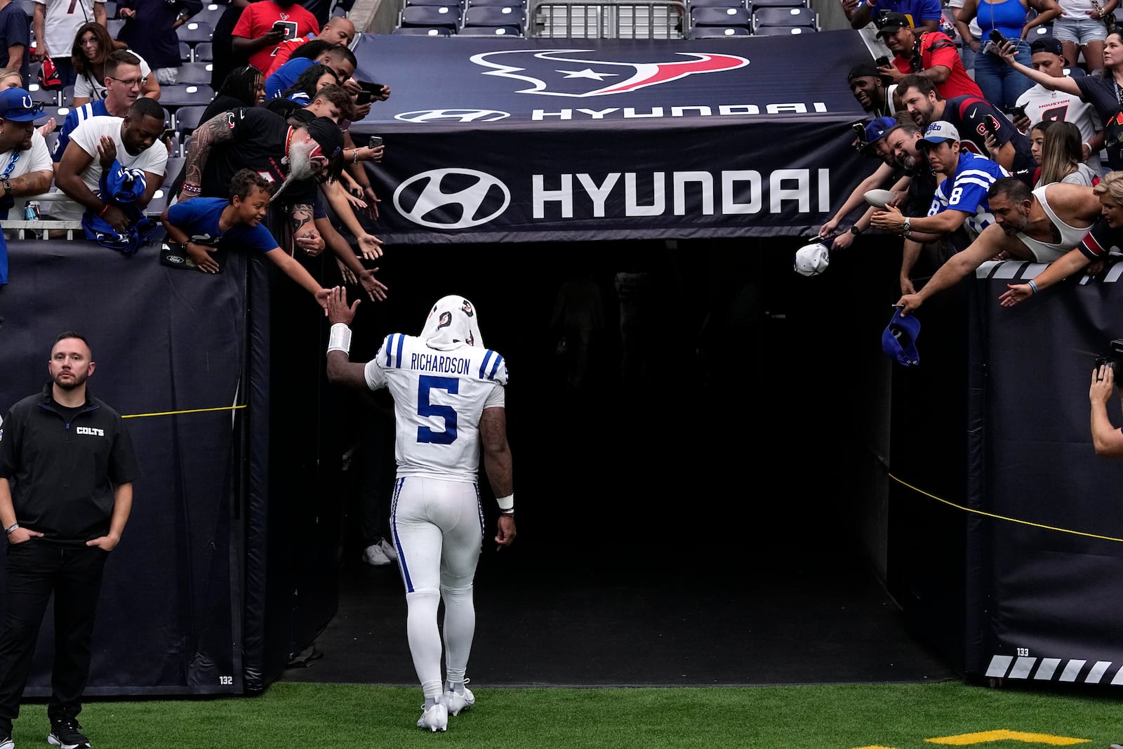 Indianapolis Colts quarterback Anthony Richardson walks off the field after an NFL football game against the Houston Texans, Sunday, Oct. 27, 2024, in Houston. The Texans won 23-20. (AP Photo/Tony Gutierrez)